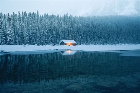 Landscape Reflection Photography Of House Covered With Snow With Pine