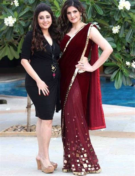 Zarine Khan In Red Saree With Sleeveless Backless Maroon Velvet Blouse