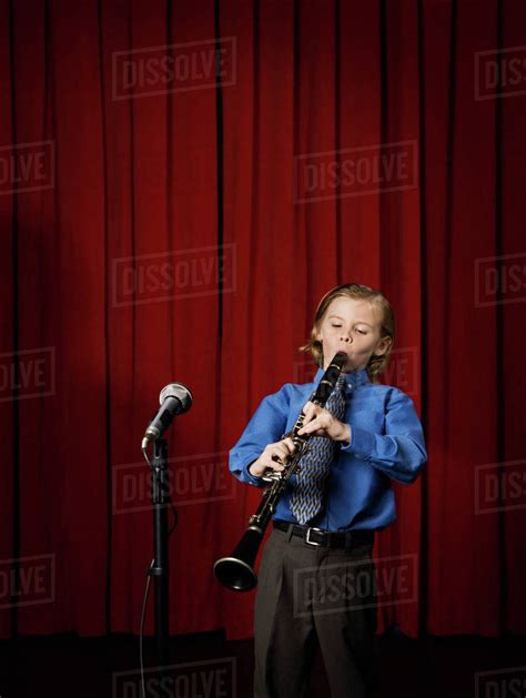 Boy Playing Clarinet On Stage Stock Photo Dissolve