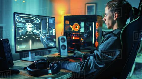 Cheerful Gamer Playing First Person Shooter Online Video Game On His