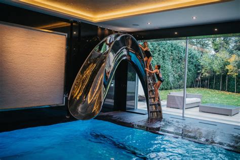 Sleek Sculptural Water Slides For The Modern Pool Design Milk