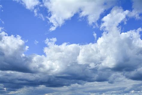 White Fluffy Clouds In Blue Sky Background From Clouds Stock Image