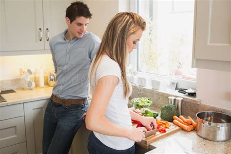 Man Watching Woman Preparing Vegetables Stock Image Image Of Saucepan