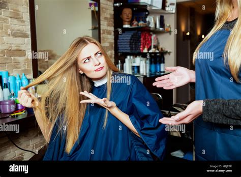 Beautiful Girl Showing Her Hair To Hairdresser Stock Photo Alamy