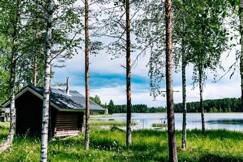Finnish Log Sauna By Blue Lake On Summer Day In Finland Stock Image