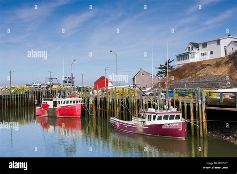 Fishing Boats Docked At The Wharf Halls Harbour Nova Scotia Canada