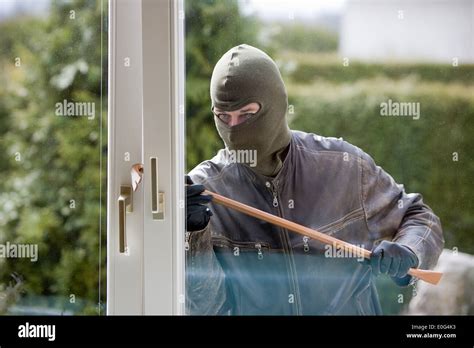 Burglar At A Window Housebreaker Burglary Stock Photo Royalty Free