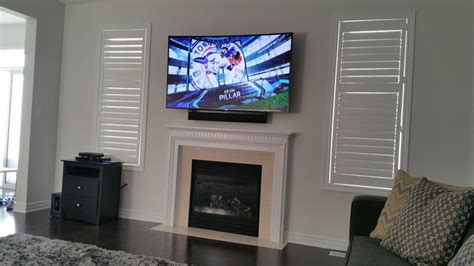 Thinking about a tv above the fireplace? TV wall mount installation with wire concealment over ...