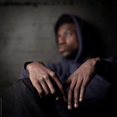 Sad Black Man In Front Of Grunge Wall By Stocksy Contributor Robert