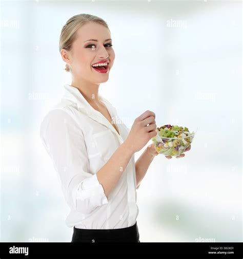 Young Businesswoman Eating Salad Stock Photo Alamy