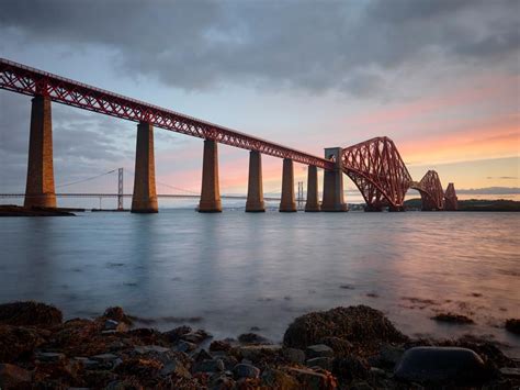 The Firth Of Forth Bridge Is An Iconic Scottish Landmark Linking