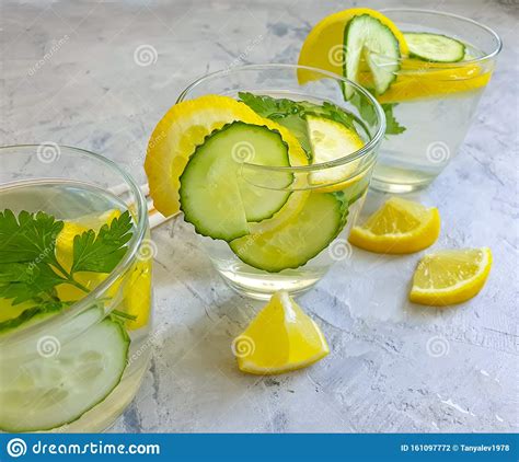 Water with Lemon, Parsley on a Concrete Background Stock Photo - Image