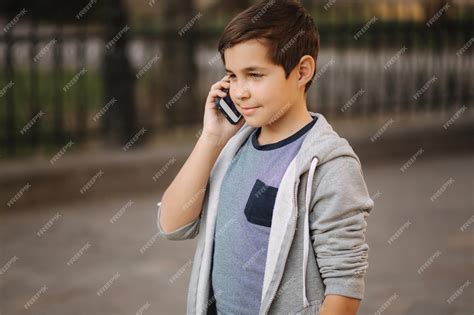 Premium Photo Young Boy Call His Mom Teenage Boy Use Phone Outside