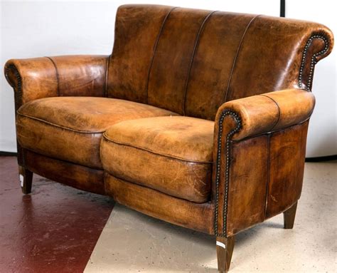 A Vintage French Distressed Art Deco Leather Sofa A Fine Constructed