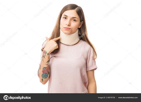 Portrait Woman Wearing Neck Brace While Pointing White Background Stock