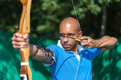 Archer Aiming At Target With Bow And Arrow Stock Image Image Of