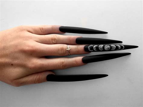 Stiletto nails are becoming quite the trend for those who love elaborate nail designs! XXXtra Long Moon Phase Matte Black stiletto nails by ...