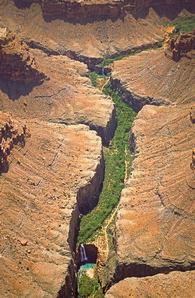 Aerial View Of Havasu Canyon Showing Mooney Falls In The Foreground