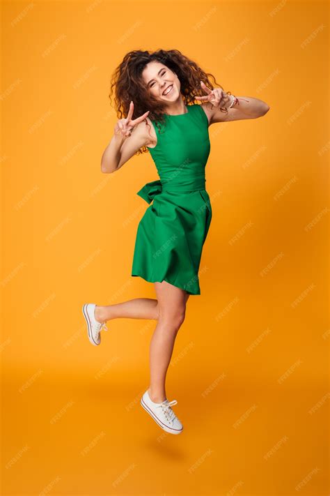 Premium Photo Full Length Portrait Of An Excited Curly Haired Girl