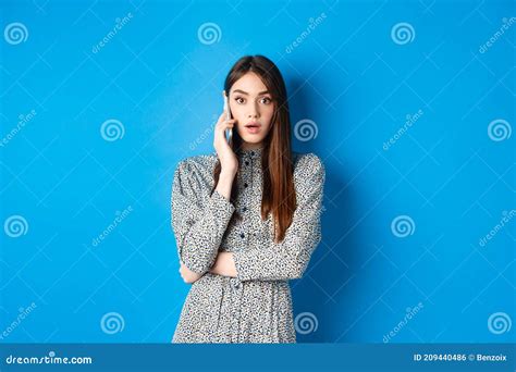 Shocked Girl Talking On Mobile Phone Gasping Amazed At Camera Speaking With Someone And Hear