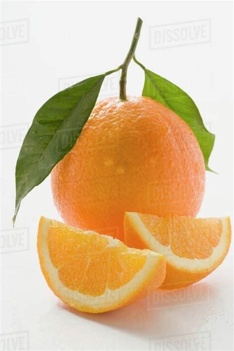 Orange With Stalk And Leaf Orange Wedges Stock Photo Dissolve