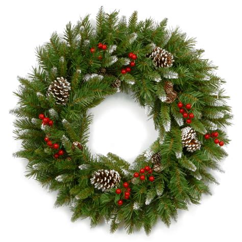 A Christmas Wreath With Pine Cones And Red Berries