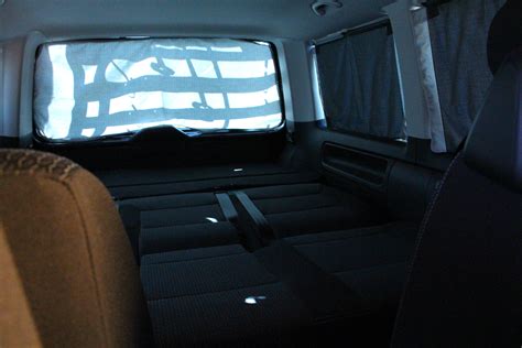 Vw t5 t6 multivan bully bett lattenrost in niedersachsen vw bus t4 multivan zweite serie bett hinten ausgeklappt vw t5 sitzbank multivan bett schlafbank schlafsitzbank grau stoff Schlafen im VW Bulli T6 Multivan - Schlafen im Auto