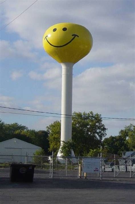 A Large Yellow Smiley Face Water Tower