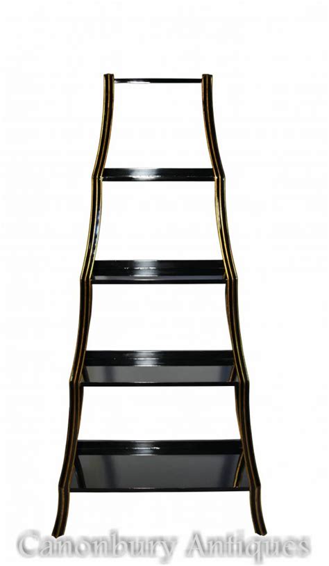 Black lacquer furniture is a classic oriental style that contrasts the shining black with gold and looks simple chinese style tall bookcase with 3 removable shelves in satin black finish with gold. Regency Black Lacquer Etagere Bookcase Shelf Unit