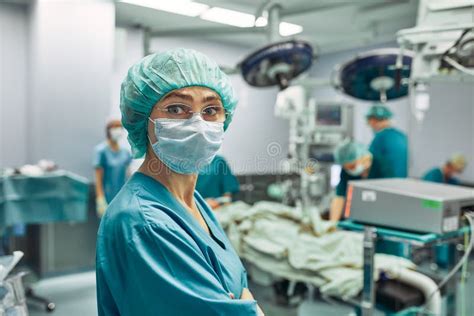 Portrait Of A Female Surgeon Operation In The Background Surgery
