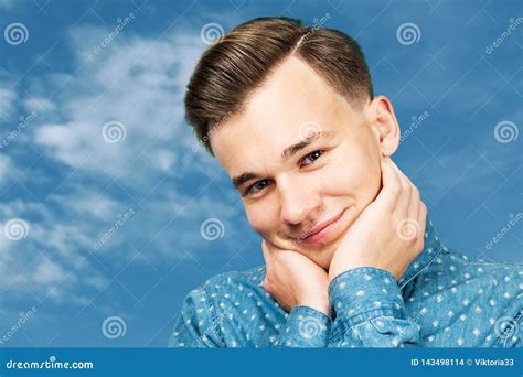 Portrait White Cute Young Guy Smiles Man Dressed In A Blue Shirt Hugs