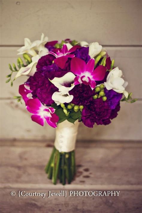 Bright wedding flowers bridal bouquet orchids fuschia. Fuschia wedding flower arrangements | Fuschia wedding ...