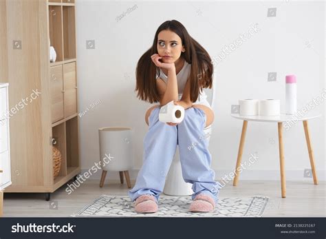 Girl Sitting On The Toilet Shutterstock