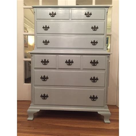 Completed by a classic collar, buttons on the sleeves and button fastening. Light Blue Tall Boy Dresser | Chairish