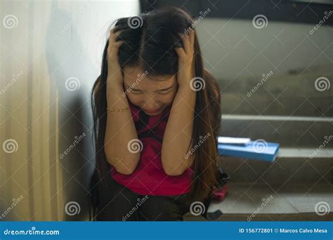 Young Beautiful Depressed Asian Korean College Student Sitting On