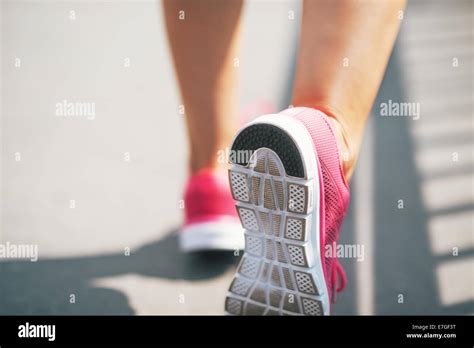 Closeup On Sneaker Of Fitness Young Woman Stock Photo Royalty Free