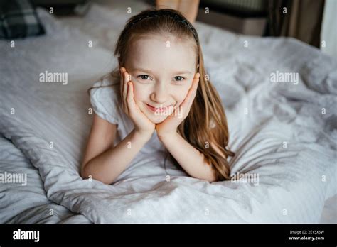 Girl Lying On The Bed Stock Photo Alamy