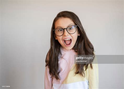 Nerd Little Girl Wearing A Large Glasses Making A Funny Face High Res