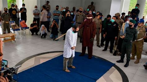 gay couple caned 77 times each for having sex in indonesia world news mirror online