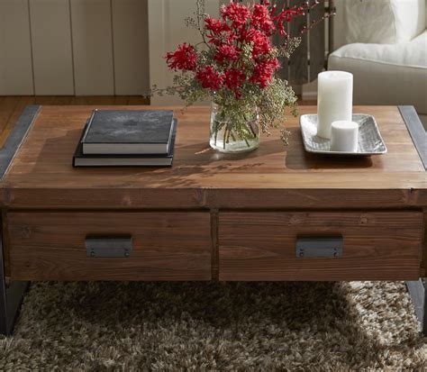 The coffee table has a roomy tabletop, which provides enough space for you to place your books, cds, toys, and more. Industrial Coffee Table With Drawers