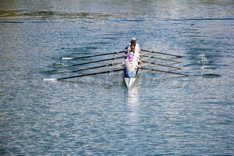 Rowers In Eight Oar Rowing Boats On The Tranquil Lake Stock Photo