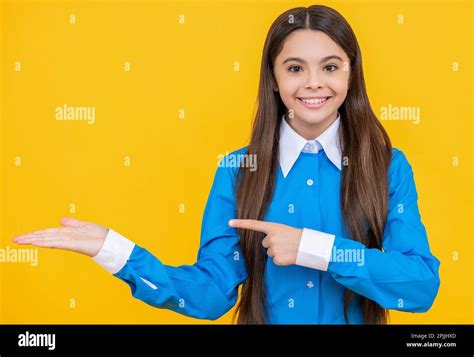 Teen School Girl Pointing Finger On Background Photo Of Teen School