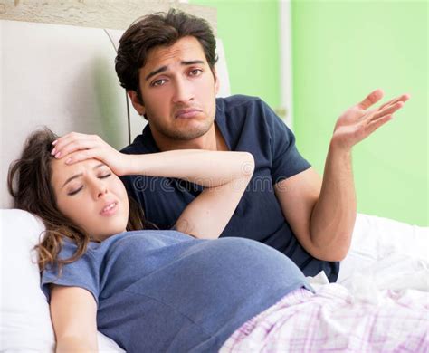 Young Husband Looking After His Pregnant Wife Stock Image Image Of