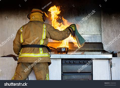 Kitchen nightmares and disasters can occur any time if you are not careful. Kitchen Fire Being Put Out By Stock Photo 12322342 ...