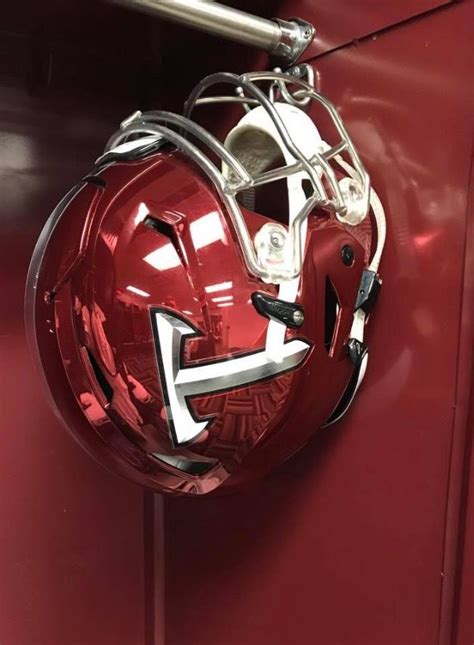 A Football Helmet Mounted To The Side Of A Locker