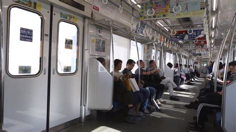 Tokyo Metro Full Underground Metro Train During Rush Hour In Tokyo Metro Passengers Look Into