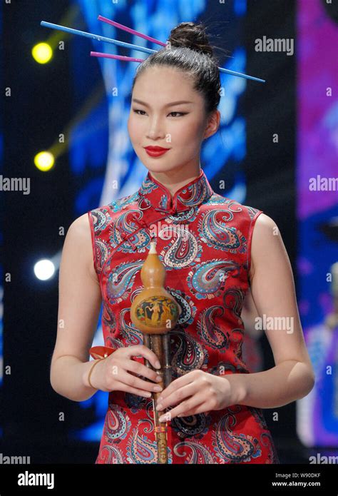 Mongolian Model Karenna Displays A Creation Of Cheongsam Also Known As Qipao In Chinese In The