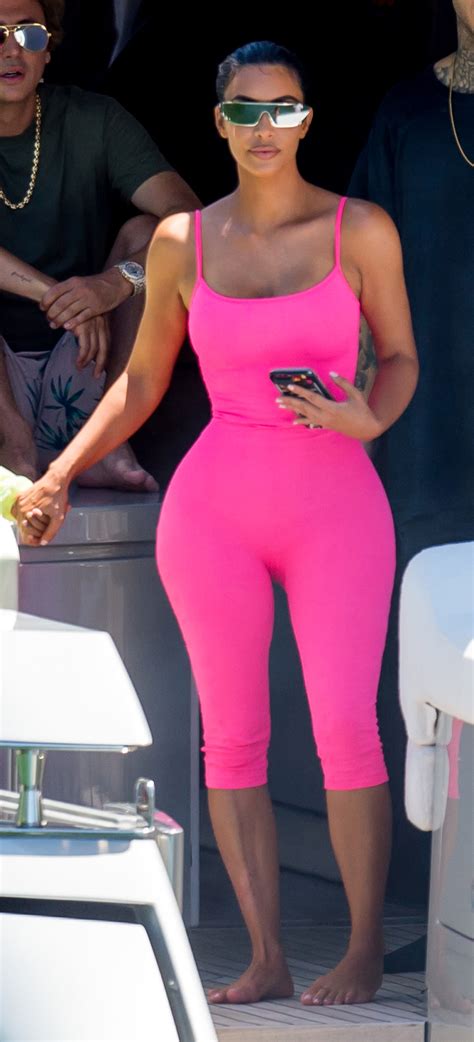 kim kardashian ditched her bikini for a neon pink adult onesie