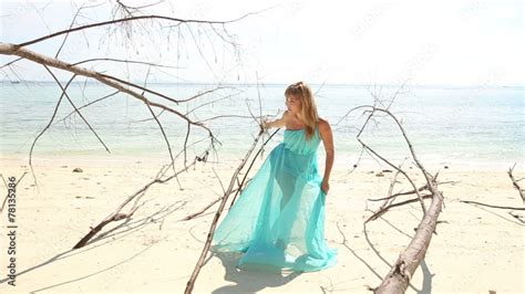 Blonde Girl In Transparent Dress Poses On Beach Stock Video Adobe Stock