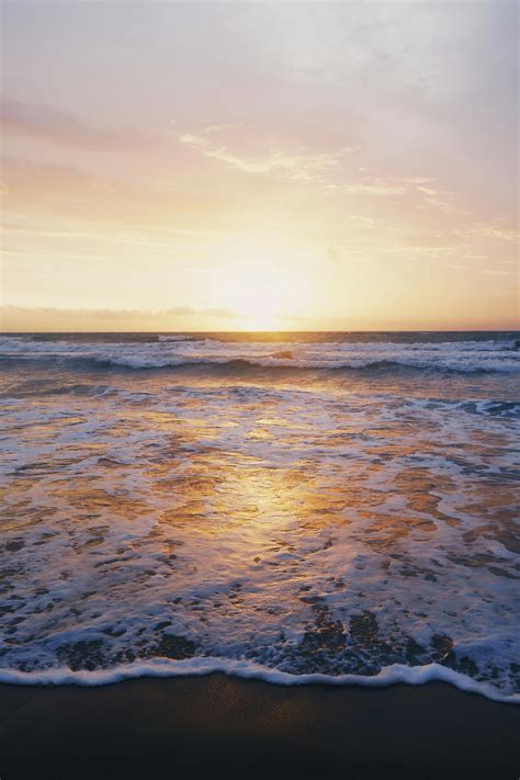 Photo Of Ocean Waves Near Seashore During Sunset · Free Stock Photo